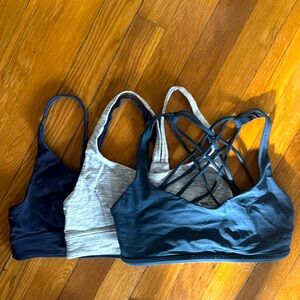 Set of three Lululemon sports bras. Size 6. Like new.